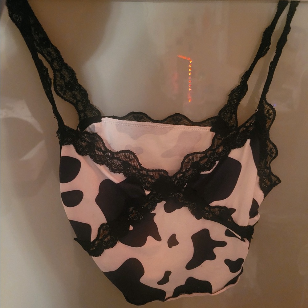 A crop top. Cow print. Hasn’t been touch in 3 years.